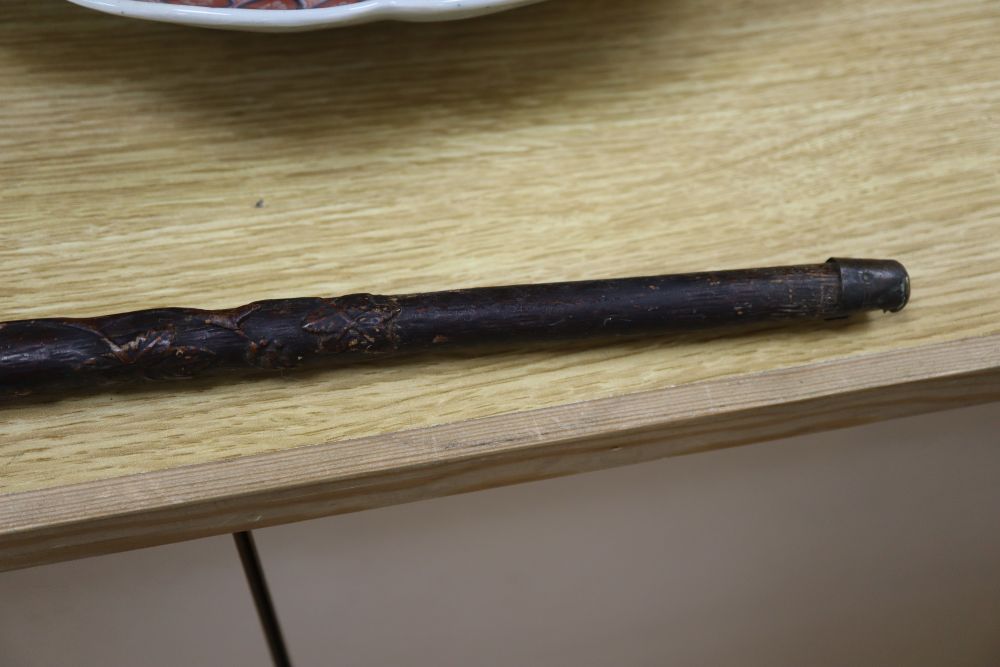 A Victorian walking stick, carved with a crown, an anchor and oak leaves, length 85cm